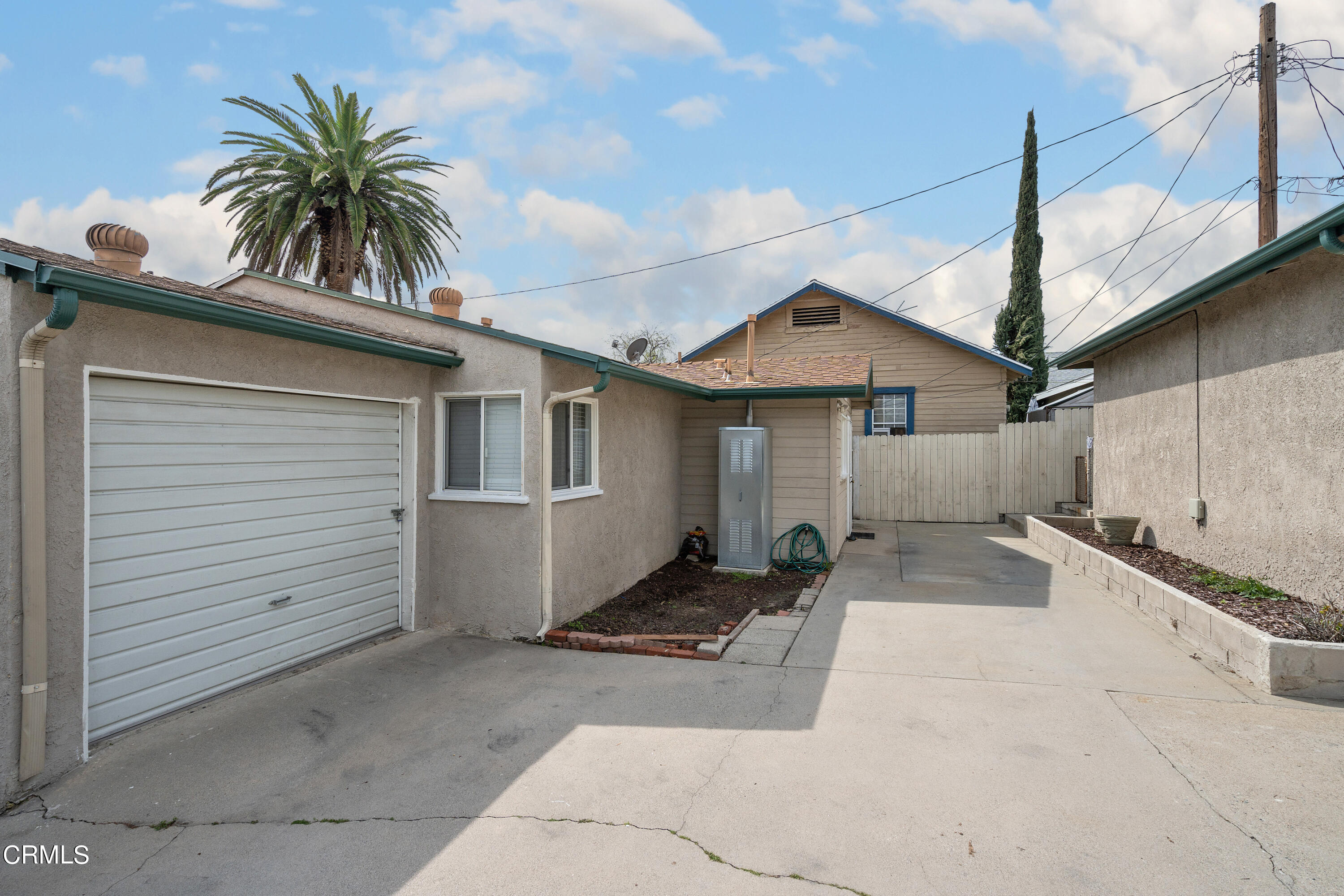 1761 Atchison Street Pasadena, CA 91104 - Photo 14 of 30 a view of a house with a yard and potted plants