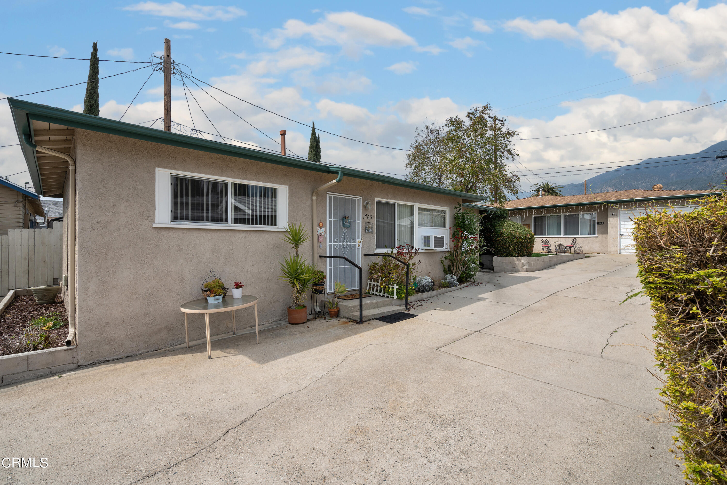 1761 Atchison Street Pasadena, CA 91104 - Photo 15 of 30 a backyard of a house with table and chairs