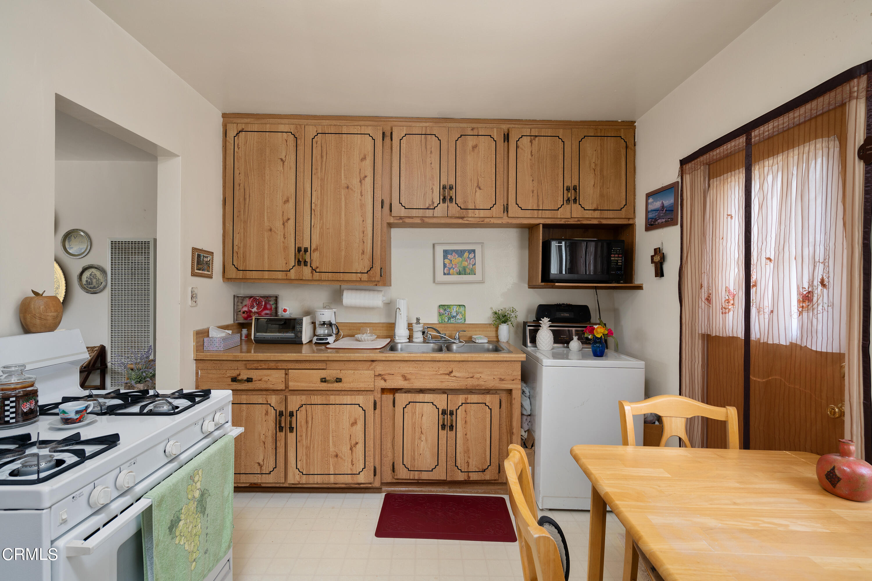1761 Atchison Street Pasadena, CA 91104 - Photo 22 of 30 a kitchen with stainless steel appliances granite countertop a stove top oven a sink dishwasher and cabinets with wooden floor