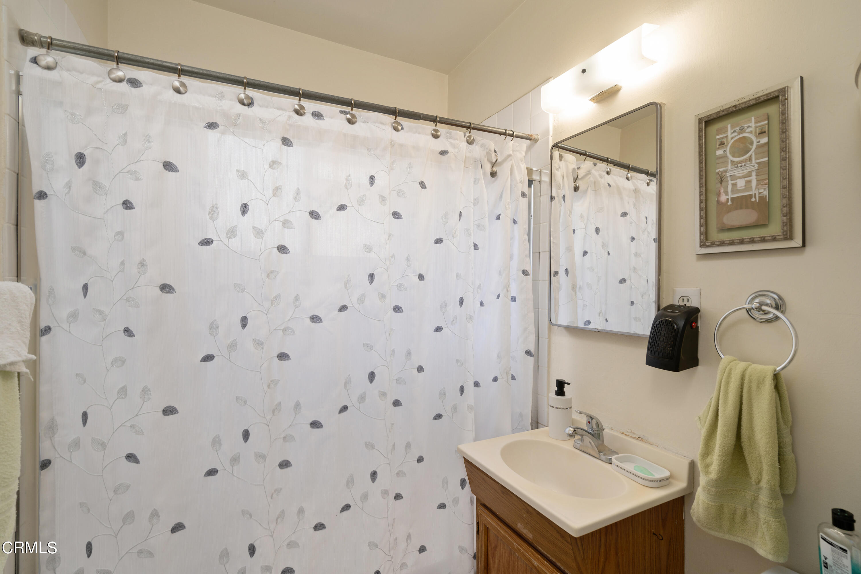 1761 Atchison Street Pasadena, CA 91104 - Photo 23 of 30 a bathroom with a sink and a mirror