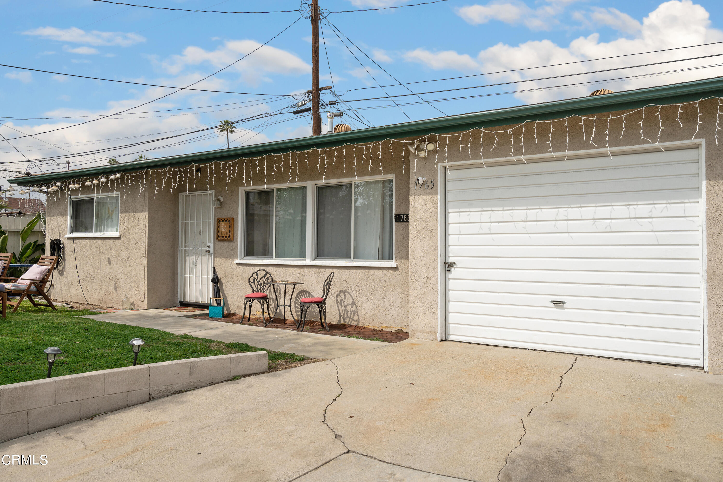 1761 Atchison Street Pasadena, CA 91104 - Photo 26 of 30 a front view of a house with a yard and garage
