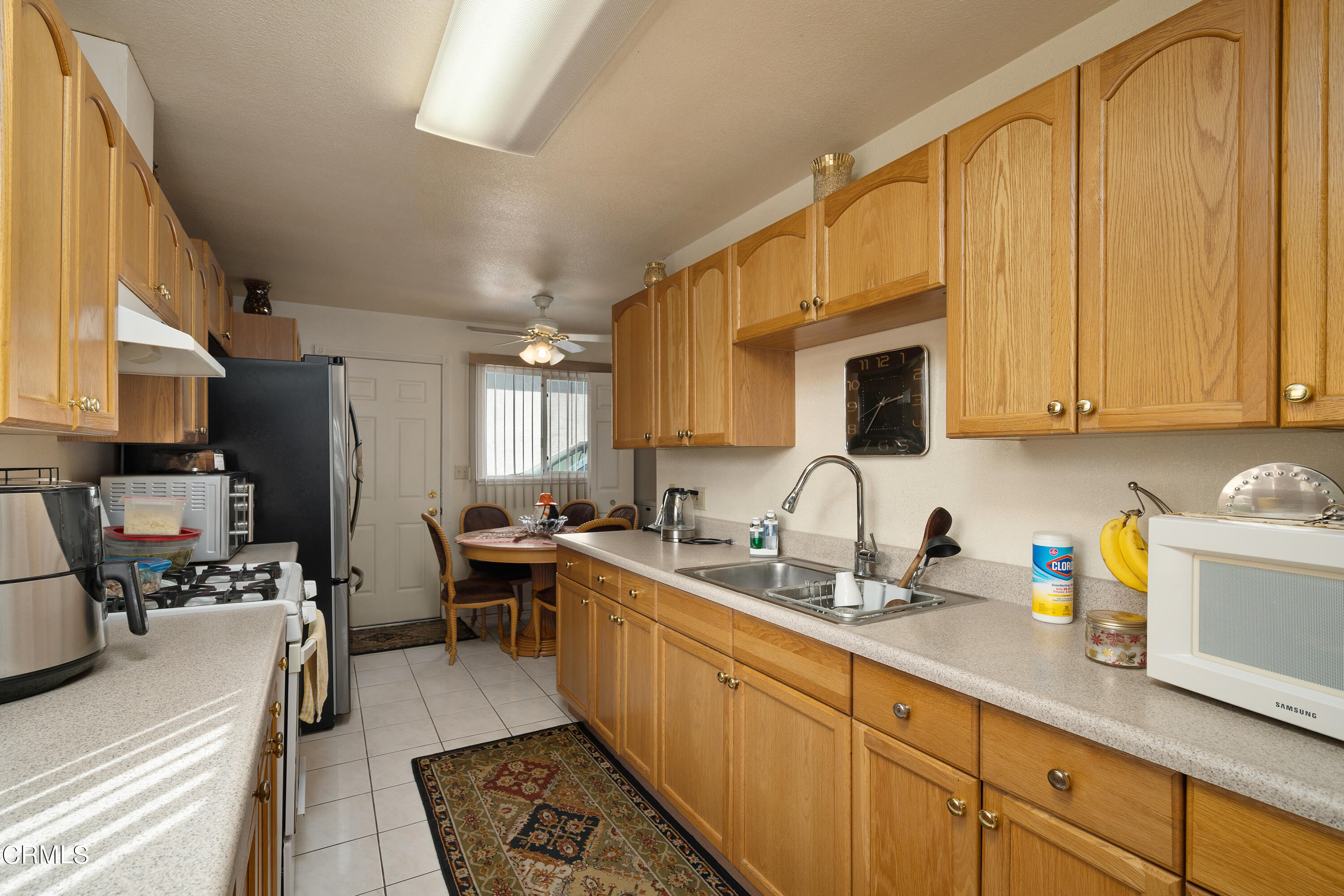 1761 Atchison Street Pasadena, CA 91104 - Photo 8 of 30 a kitchen with a sink dishwasher stove and cabinets