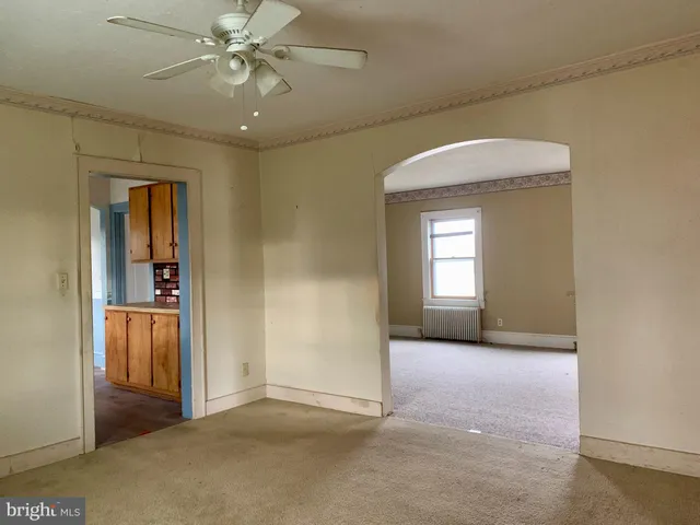 a kitchen with a sink and a stove top oven