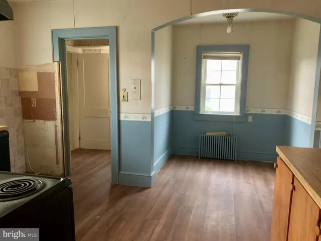 a view of a livingroom with furniture and staircase