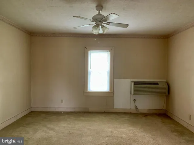a view of a big room with closet and wooden floor