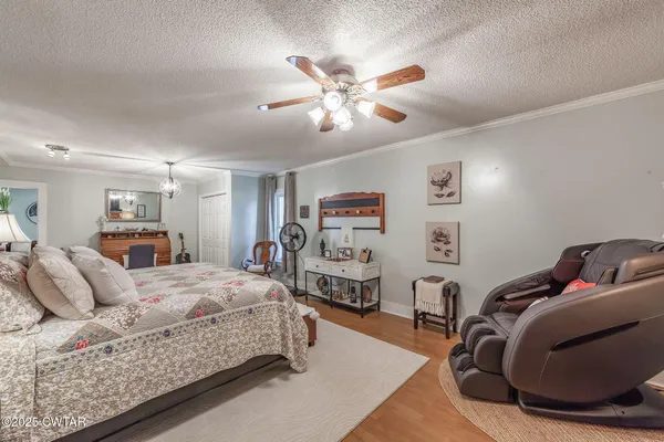a bedroom with bed and a window