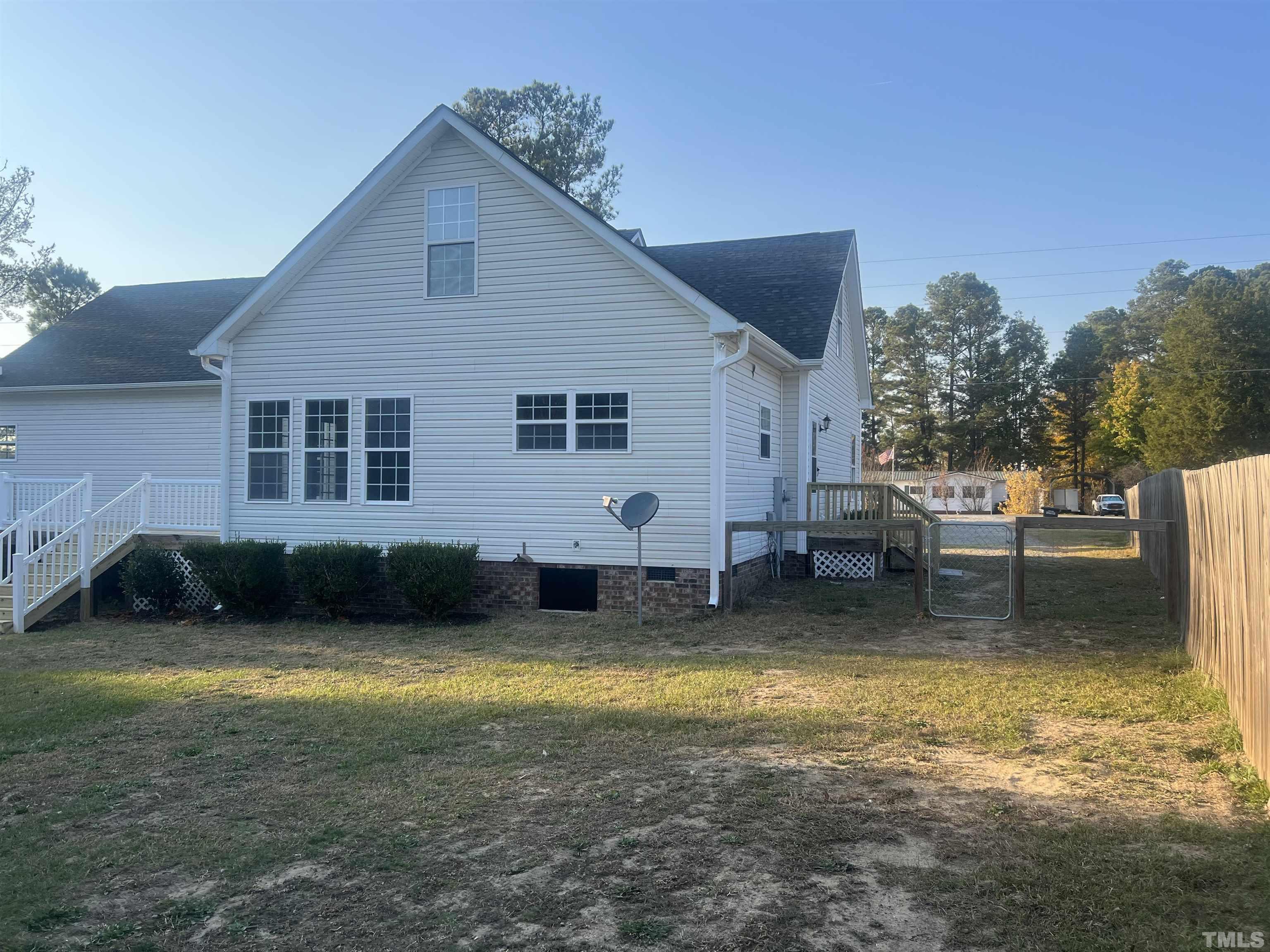 1219 Ridge Road Benson, NC 27504 - Photo 11 of 57 a view of a house with backyard swimming pool and sitting area