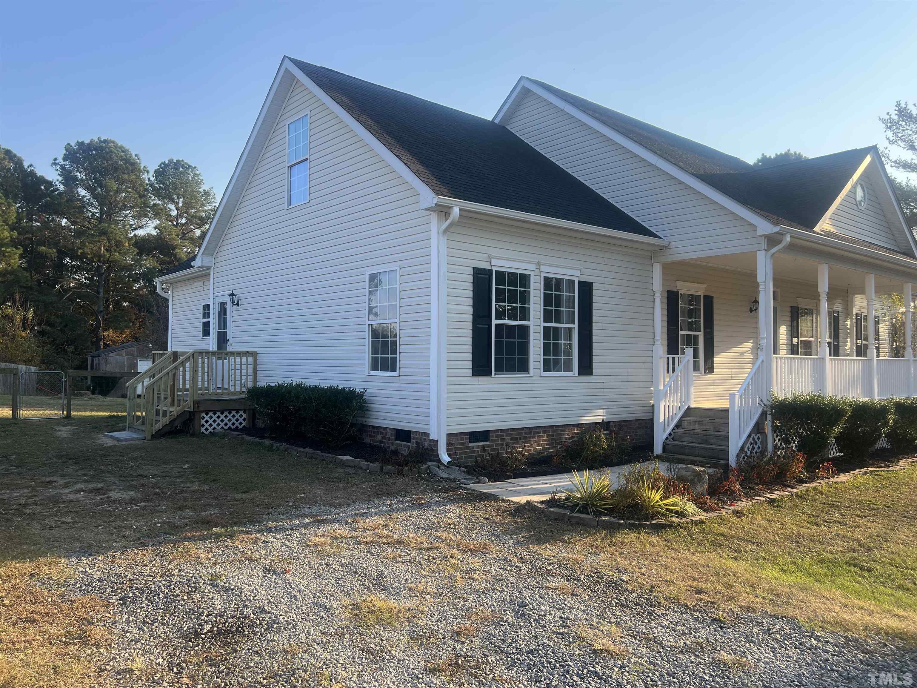 1219 Ridge Road Benson, NC 27504 - Photo 13 of 57 a front view of a house with a yard