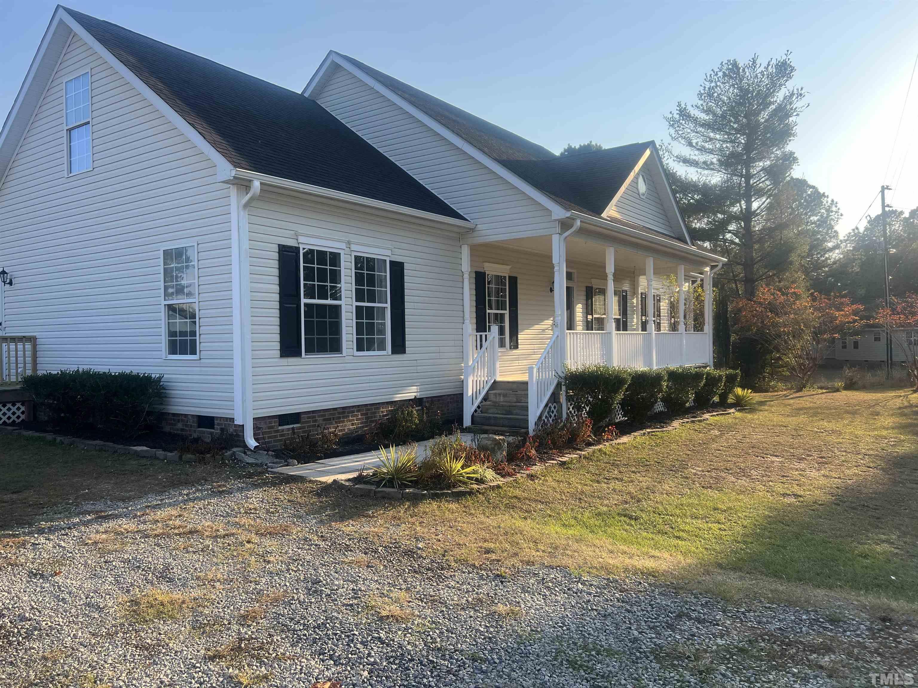 1219 Ridge Road Benson, NC 27504 - Photo 14 of 57 a view of a house with backyard and garden