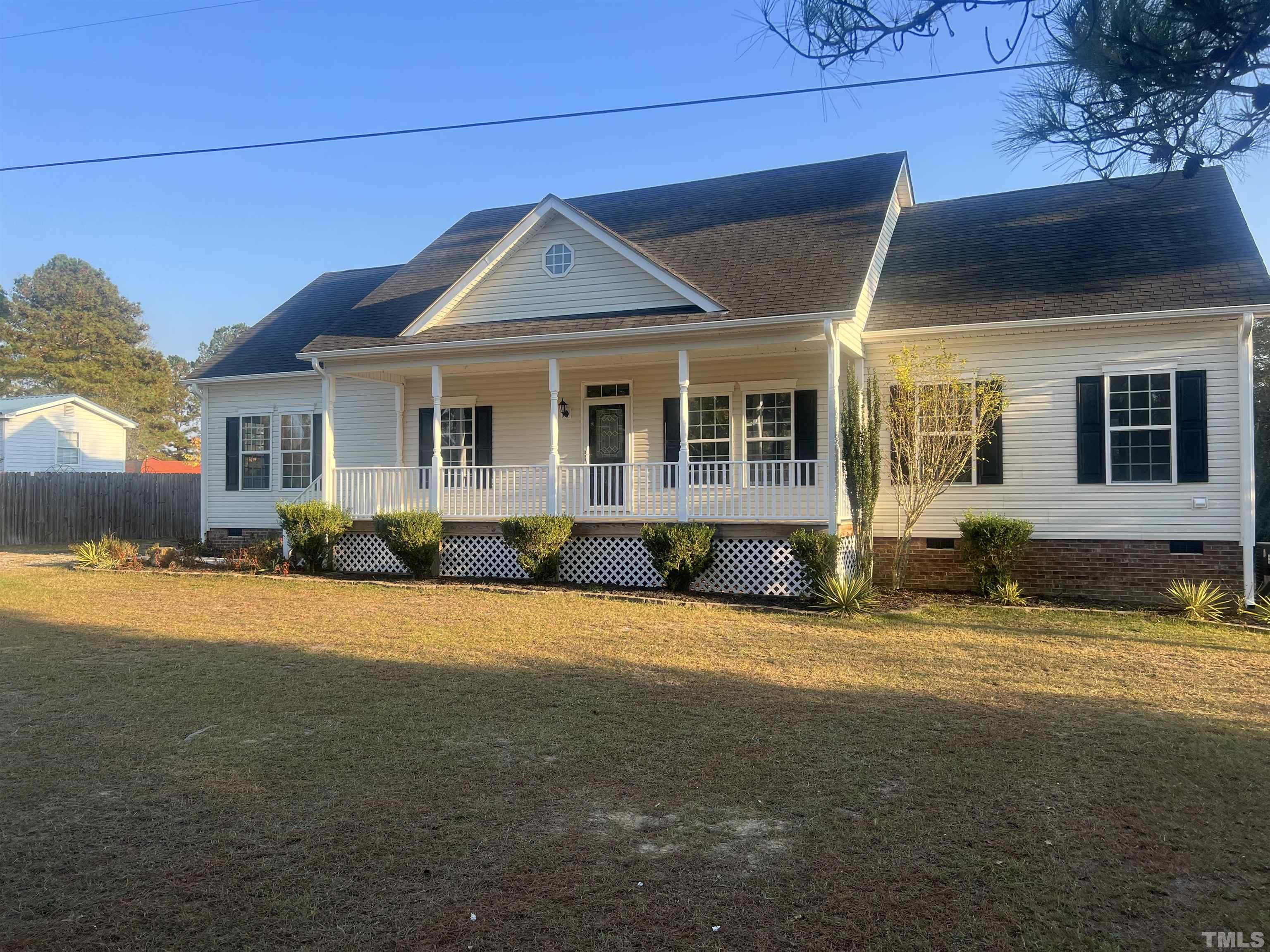 1219 Ridge Road Benson, NC 27504 - Photo 2 of 57 a front view of a house with a yard