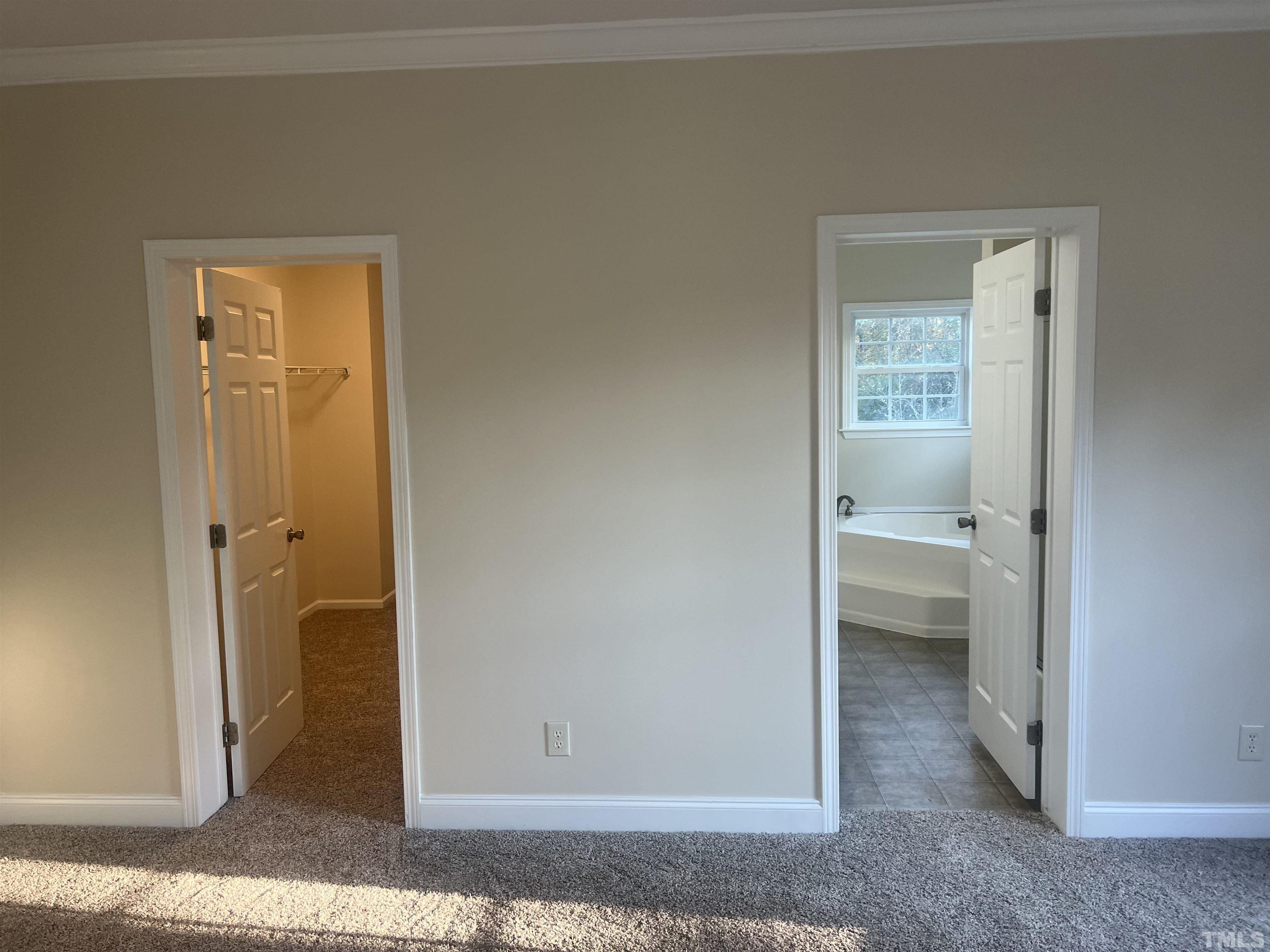 1219 Ridge Road Benson, NC 27504 - Photo 27 of 57 a view of a bathroom with a glass door and a shower