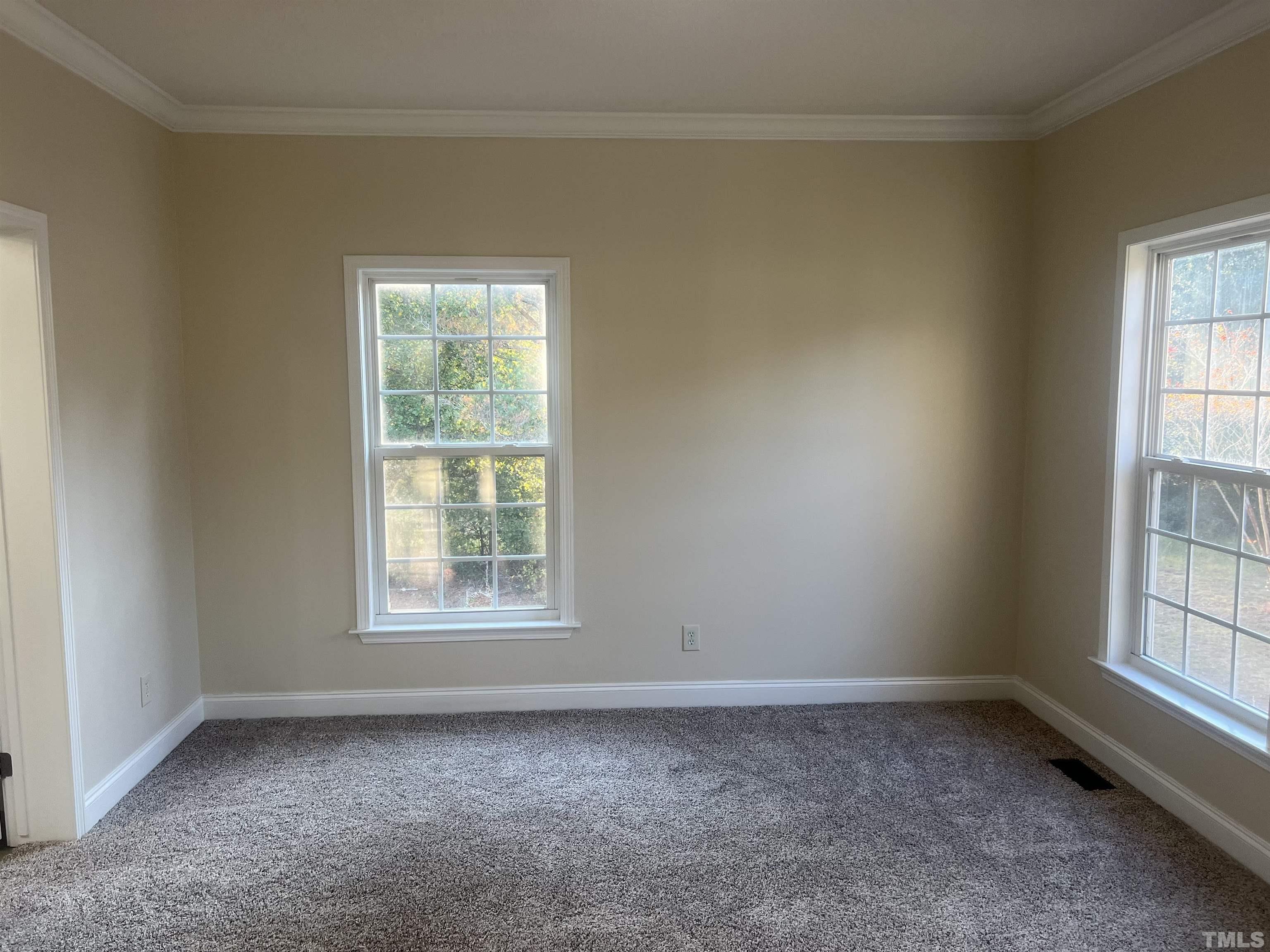 1219 Ridge Road Benson, NC 27504 - Photo 28 of 57 an empty room with a window