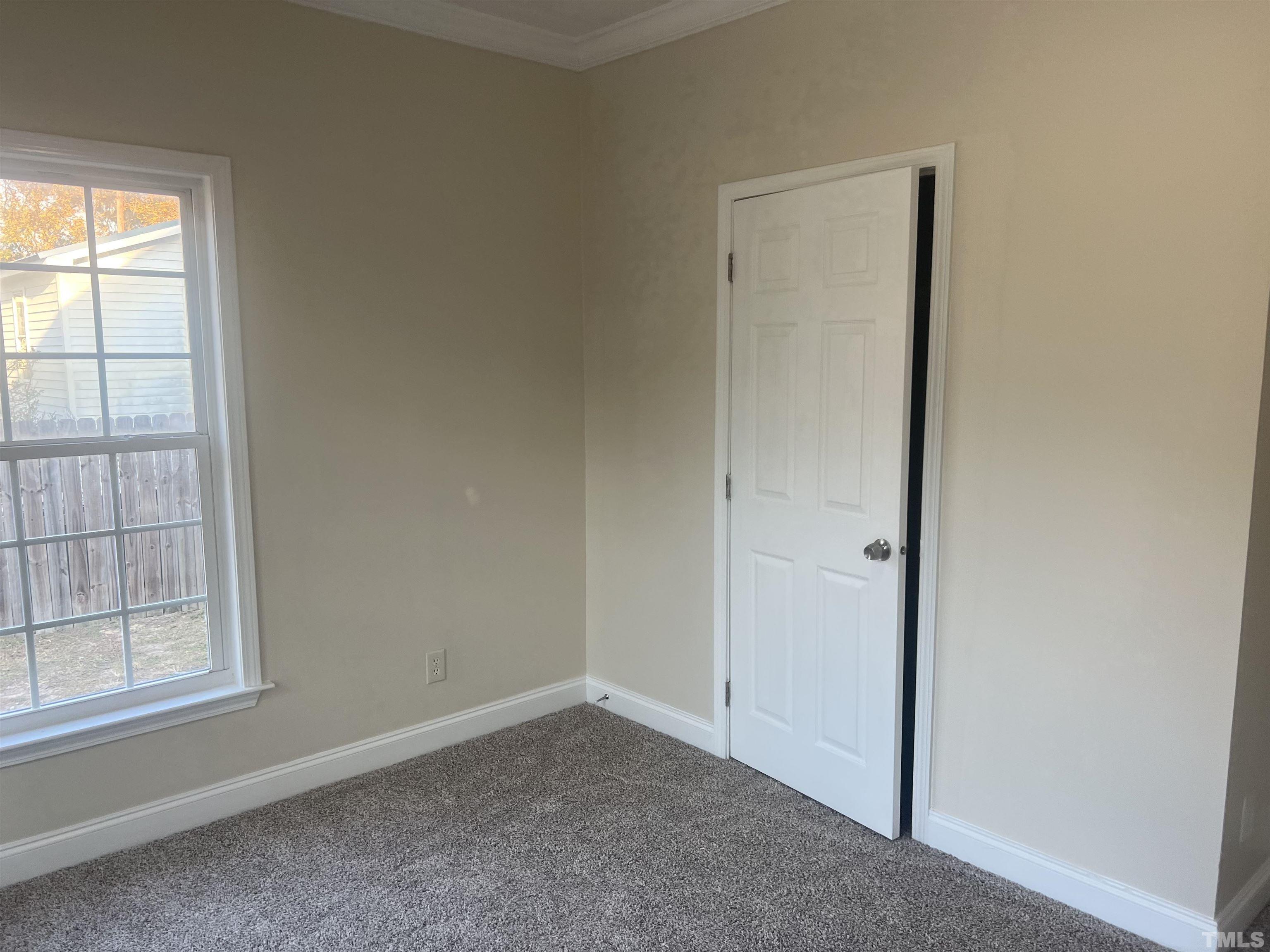 1219 Ridge Road Benson, NC 27504 - Photo 29 of 57 an empty room with windows
