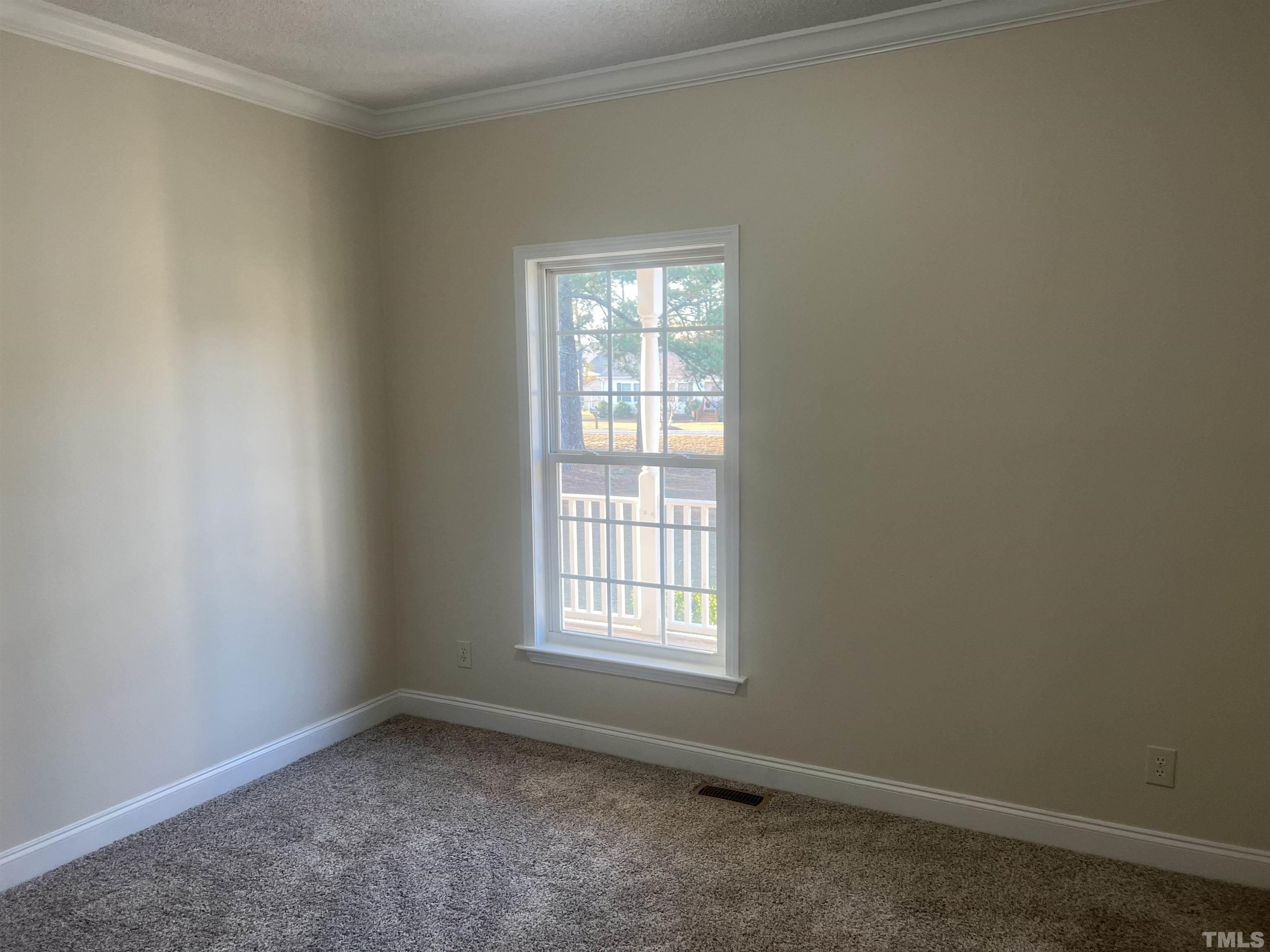 1219 Ridge Road Benson, NC 27504 - Photo 30 of 57 an empty room with a window