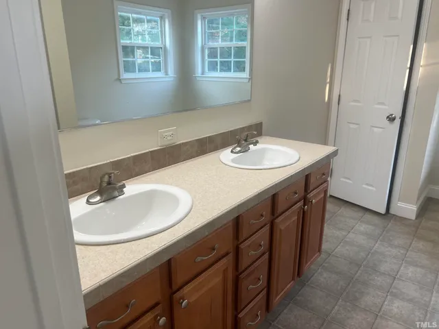 a kitchen with stainless steel appliances a refrigerator sink and cabinets