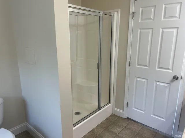 a kitchen with wooden cabinets and stainless steel appliances