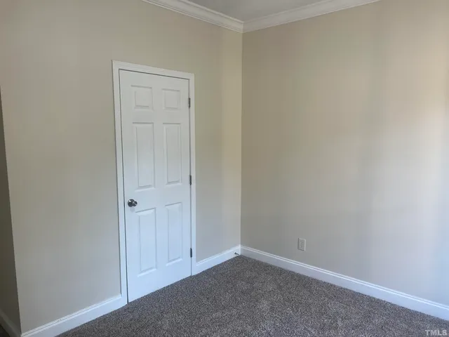 a kitchen with stainless steel appliances wooden floor and large window