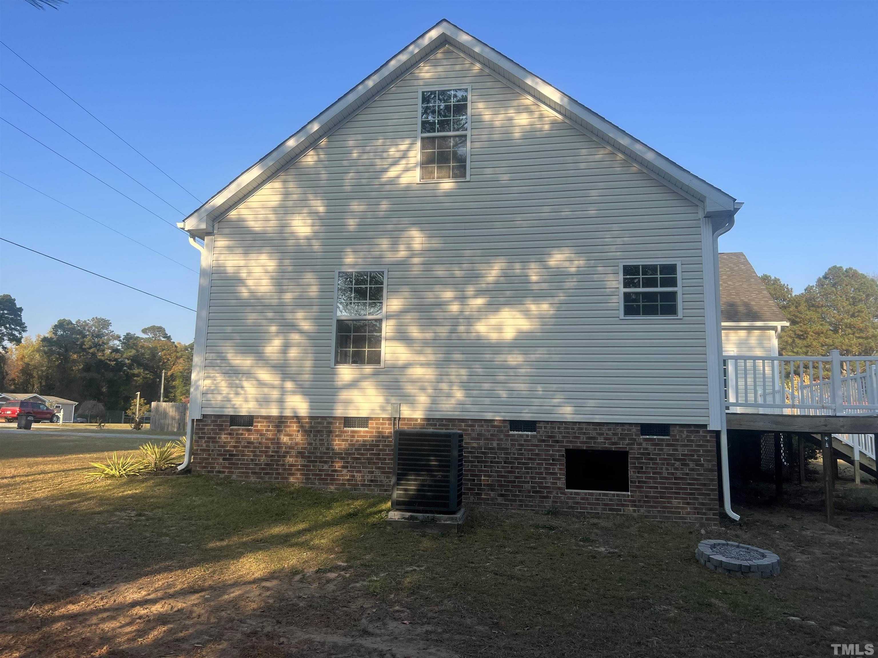 1219 Ridge Road Benson, NC 27504 - Photo 4 of 57 a front view of a house with a yard