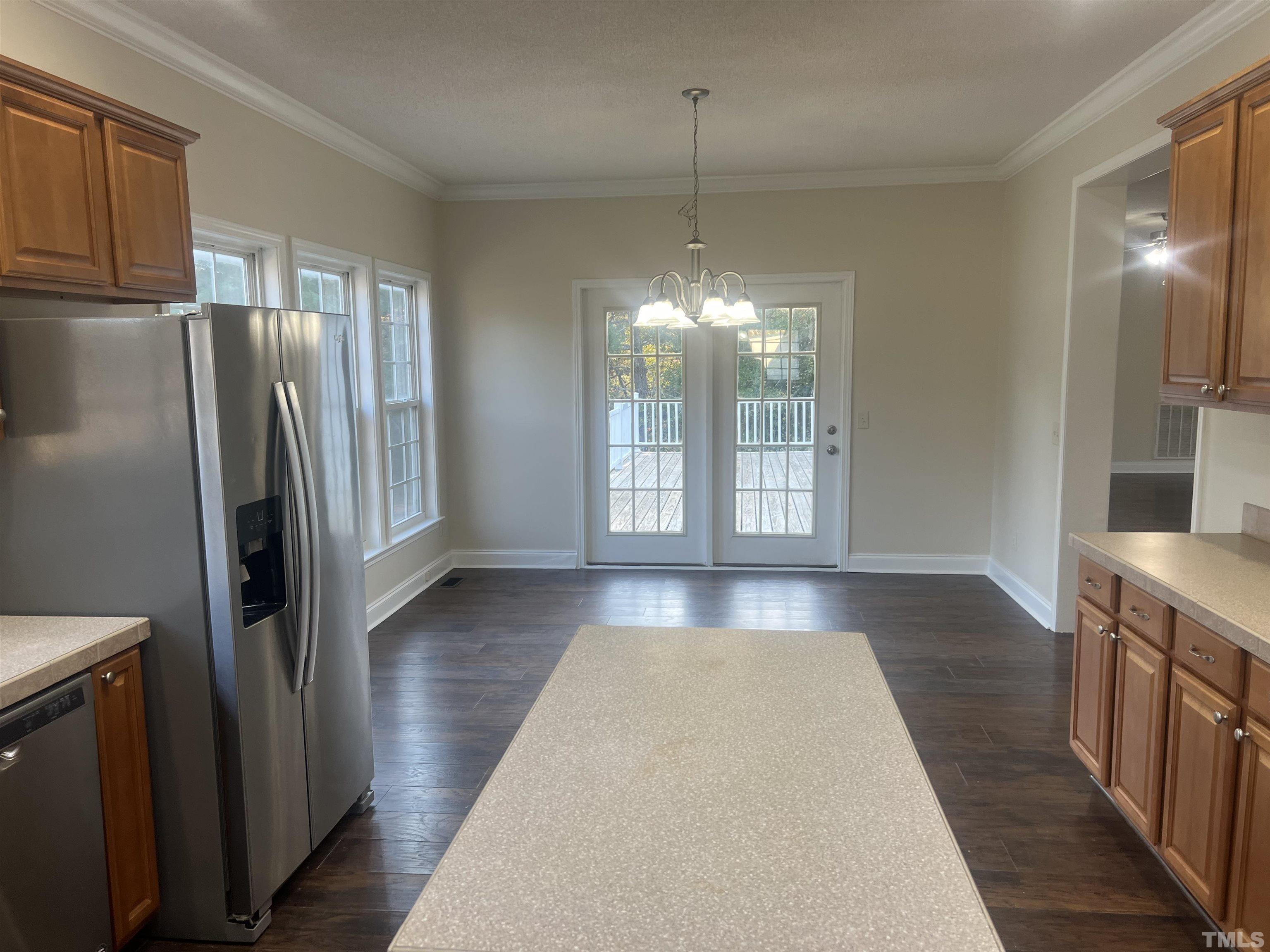 1219 Ridge Road Benson, NC 27504 - Photo 47 of 57 a view of an empty room with window and wooden floor