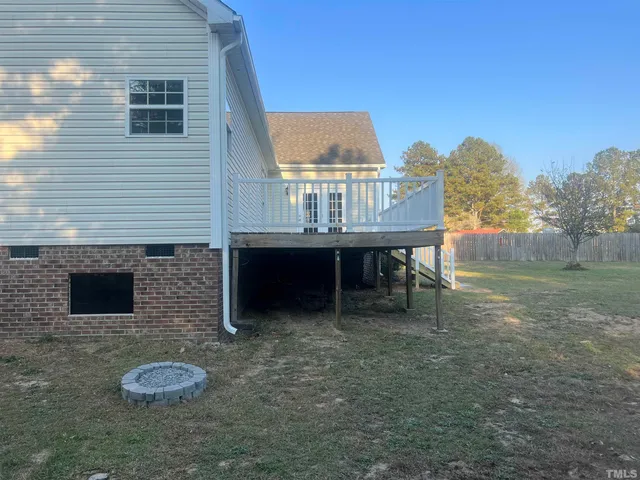 a view of outdoor space with deck and tree