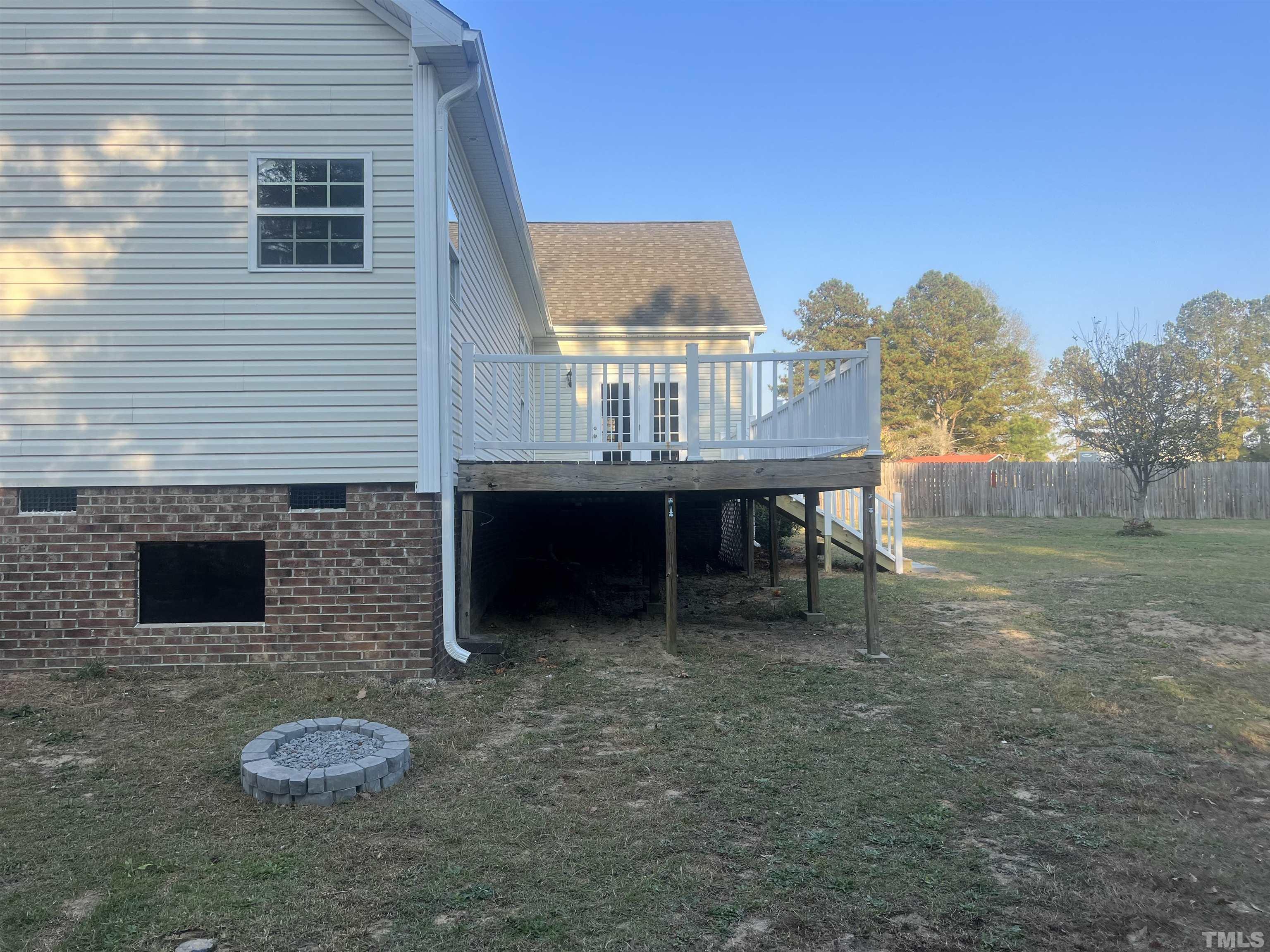 1219 Ridge Road Benson, NC 27504 - Photo 5 of 57 a view of a backyard with table and chairs