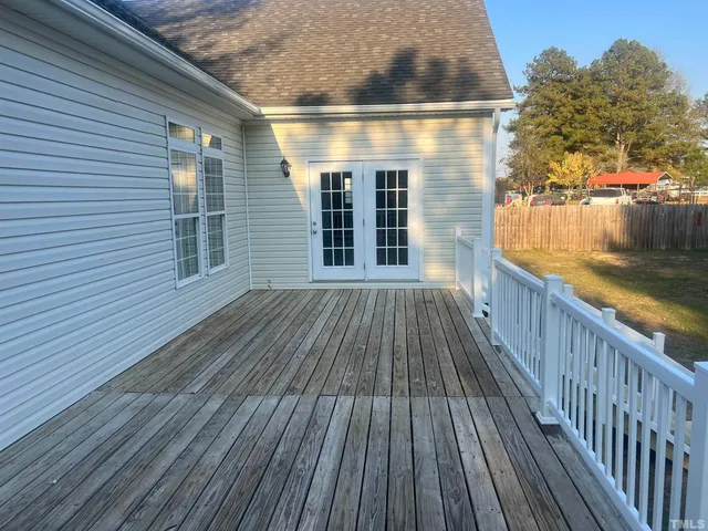a view of backyard with deck