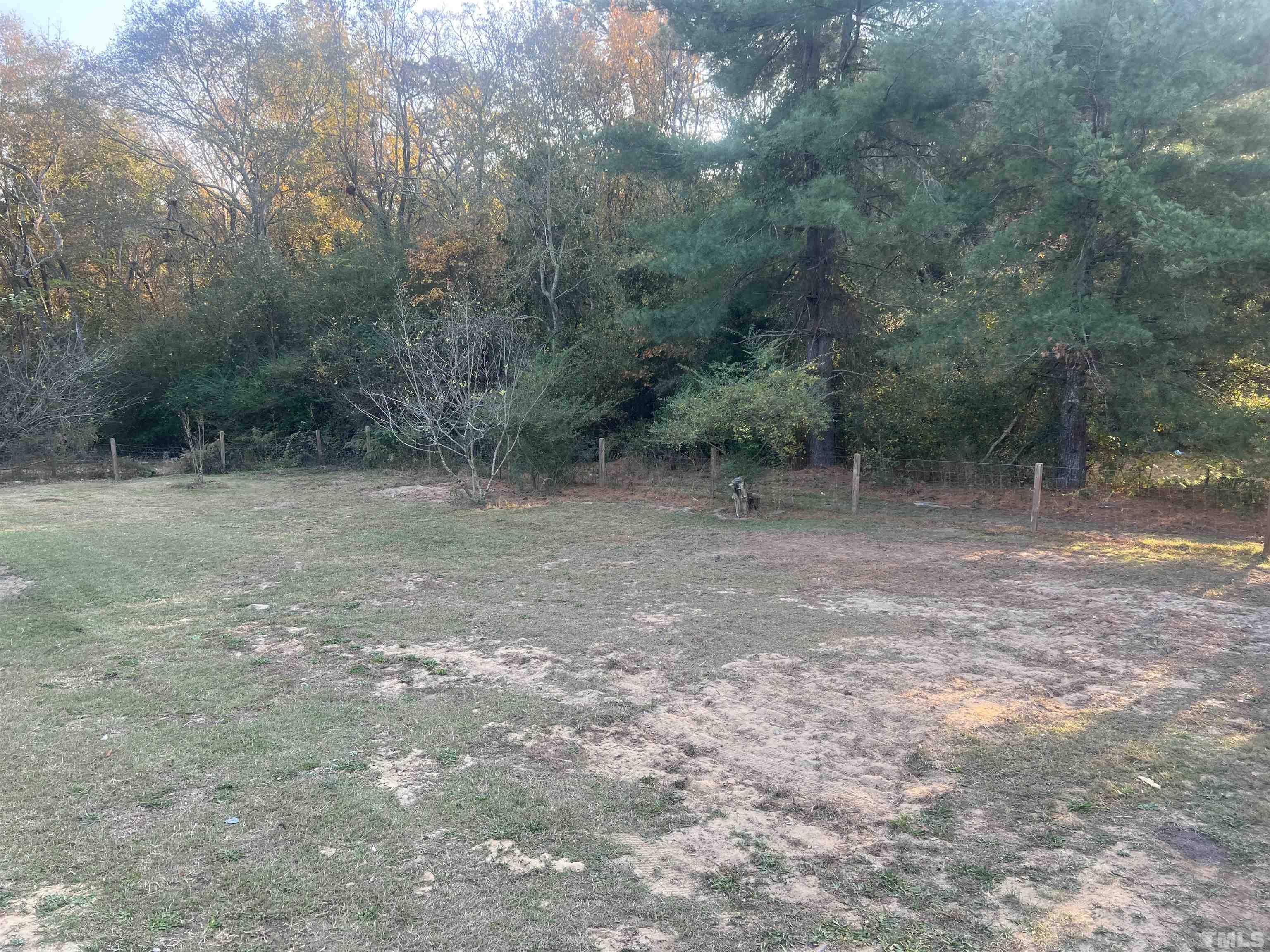 1219 Ridge Road Benson, NC 27504 - Photo 9 of 57 a view of a forest with trees in the background