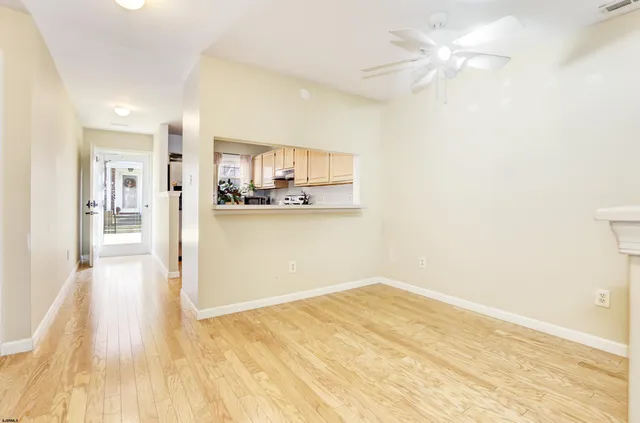 a view of a kitchen with wooden floor