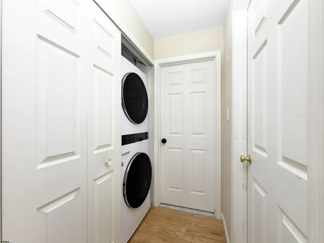a view of a hallway with washer and dryer