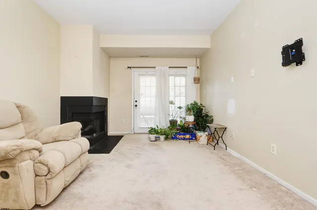 a bedroom with furniture and a potted plant