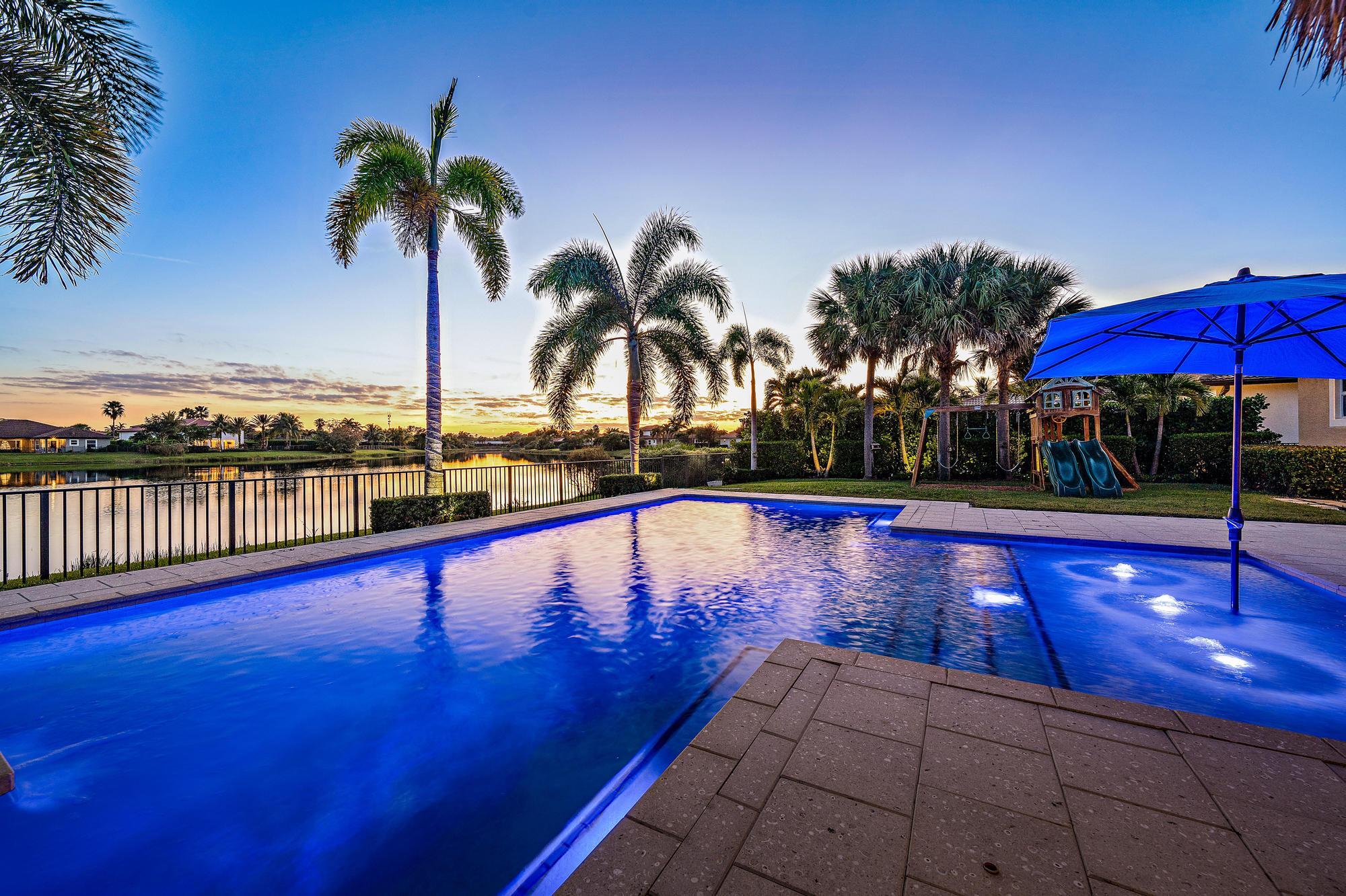 112 Manor Circle Jupiter, FL 33458 - Photo 4 of 59 Twilight Exterior Lakeview