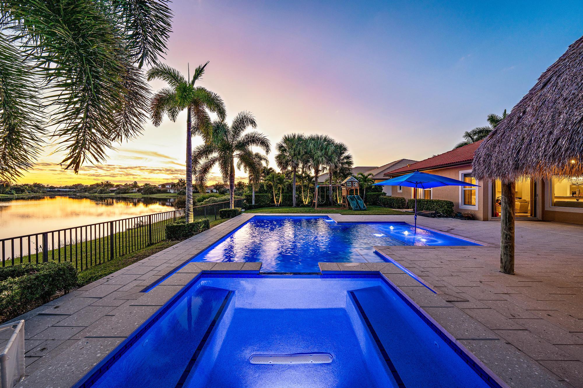 112 Manor Circle Jupiter, FL 33458 - Photo 5 of 59 Twilight Exterior Lakeview