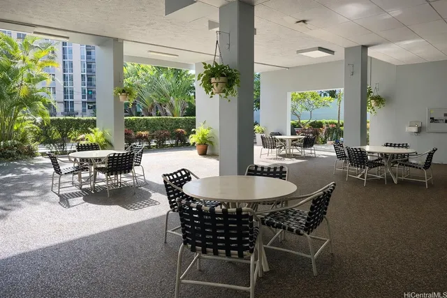a dining room with furniture window and outside view