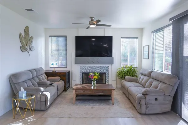 a living room with furniture and a flat screen tv