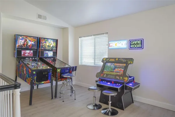 a bedroom with furniture and a window