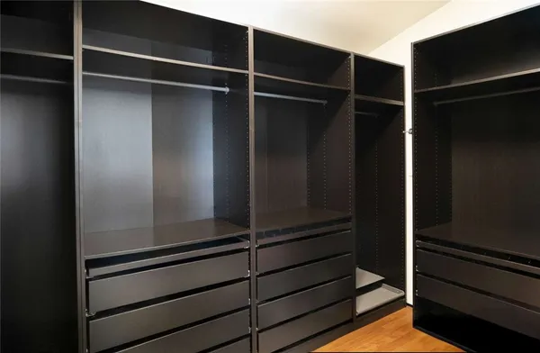 a room with a desk and a window