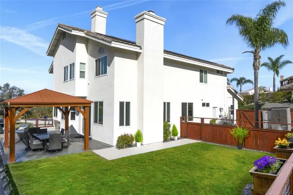 a view of yard with swimming pool outdoor seating and green space
