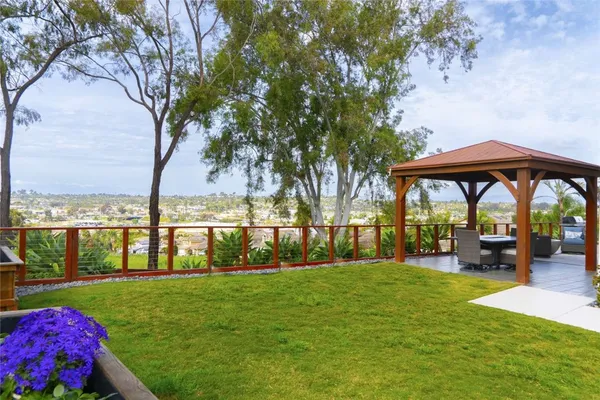 a view of a chair and table in the garden
