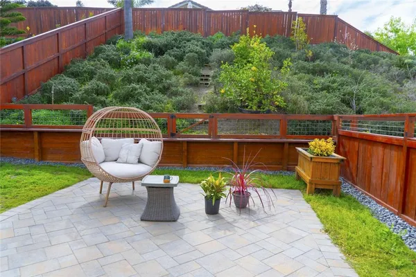 a view of a chairs and table in the patio