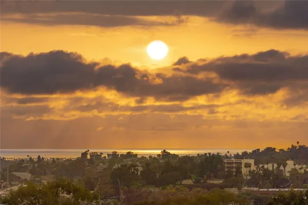 an aerial view of a house with a yard swimming pool and outdoor seating