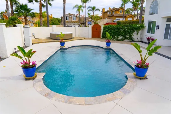 a view of swimming pool with seating space