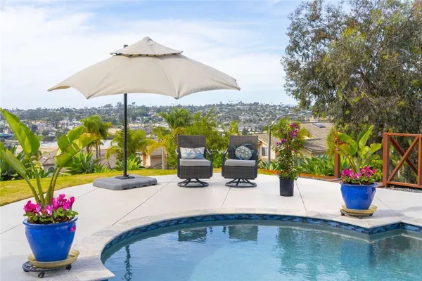 a view of a swimming pool with a patio