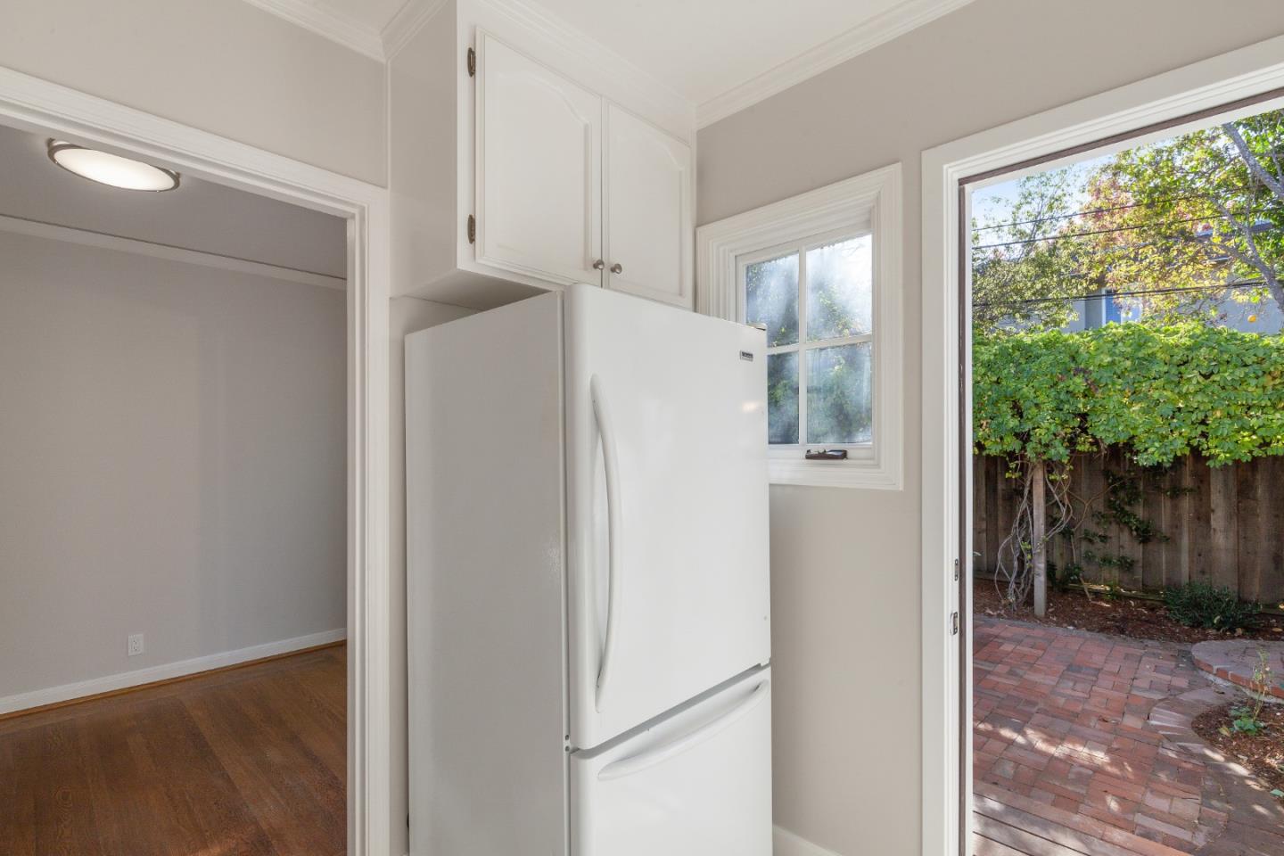 414 Williams Place San Mateo, CA 94401 - Photo 11 of 32 a white refrigerator freezer and a granite counter top