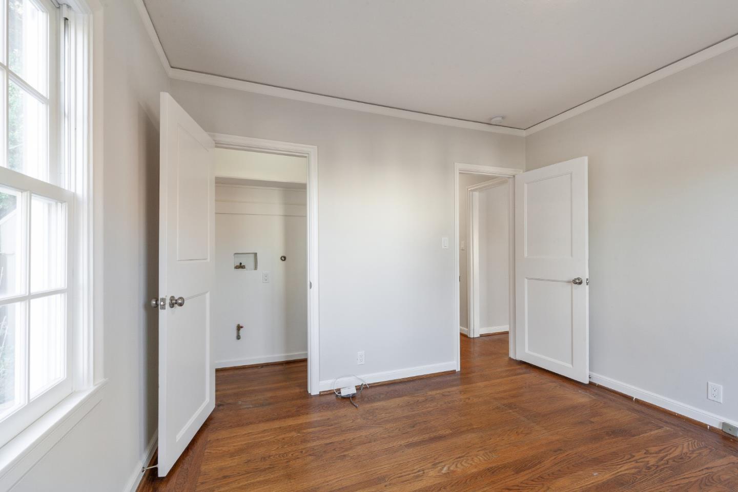 414 Williams Place San Mateo, CA 94401 - Photo 14 of 32 a view of a room with wooden floor and windows