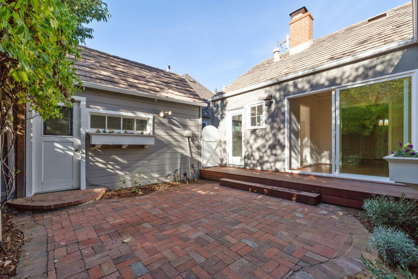 414 Williams Place San Mateo, CA 94401 - Photo 23 of 32 a view of a house with a large window and wooden fence