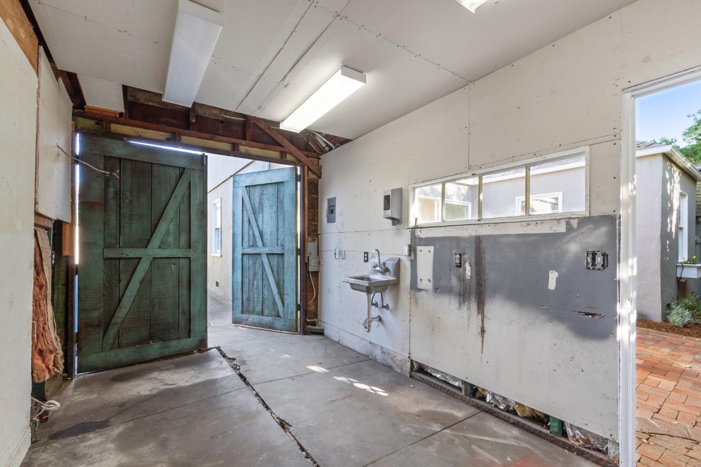 414 Williams Place San Mateo, CA 94401 - Photo 25 of 32 a view of a hallway with a glass door