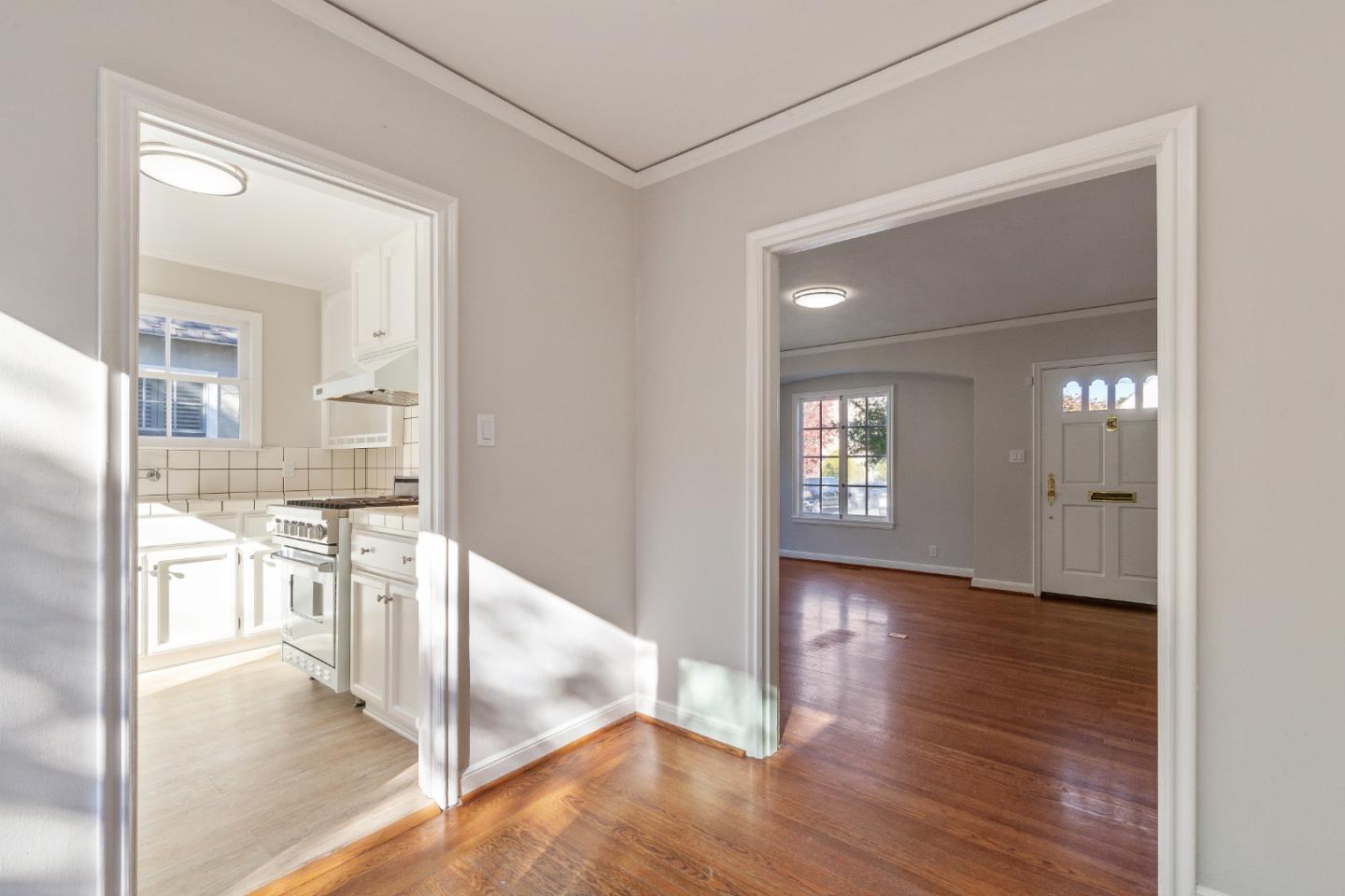 414 Williams Place San Mateo, CA 94401 - Photo 9 of 32 a view of a kitchen cabinets wooden floor and a living room