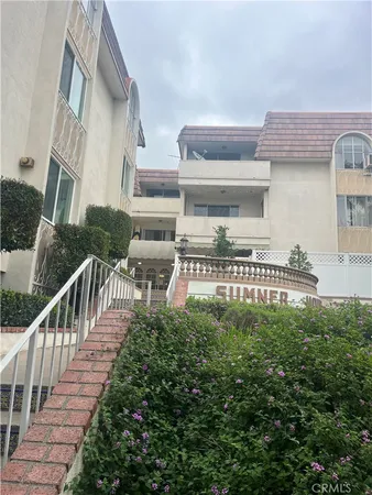 a balcony view with couches and table and chairs