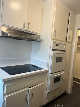 a kitchen with a sink a window and appliances