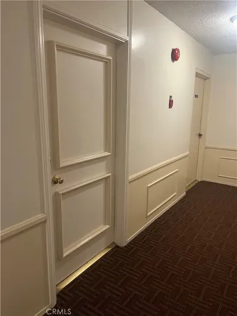 an empty room with wooden floor and window